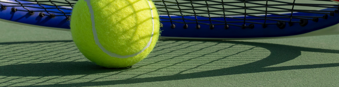 Tennis racquet and ball over a tennis court