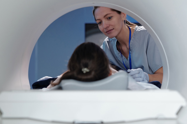 MRI technician with a patience doing a magnetic resonance