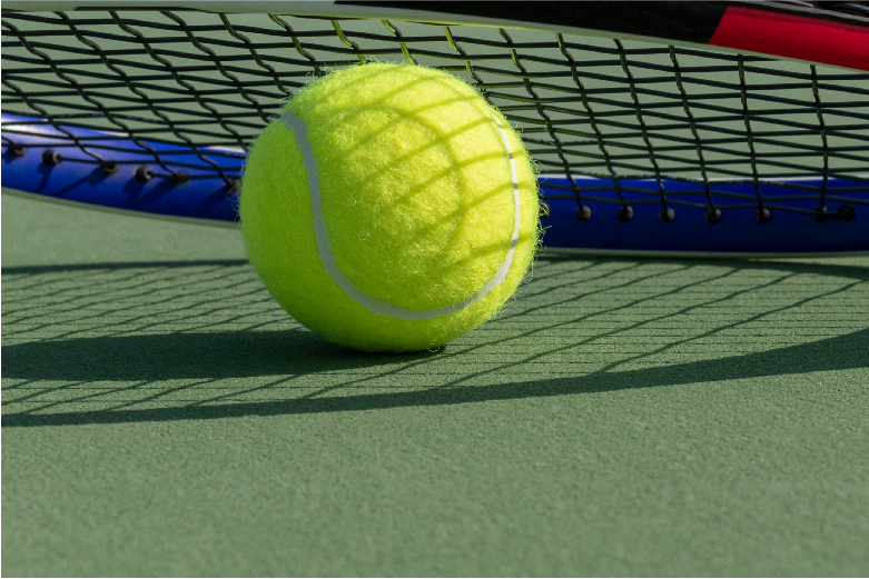 Tennis racquet and ball over a tennis court